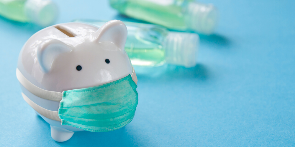 Piggy Bank wearing a mask, with hand sanitizer